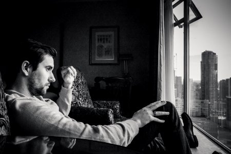 Pensive Man By Window