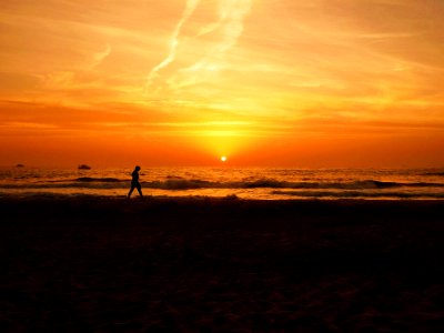 Jogging On Beach At Sunset photo