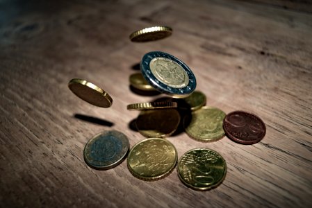 Close-up Of Coins On Table photo