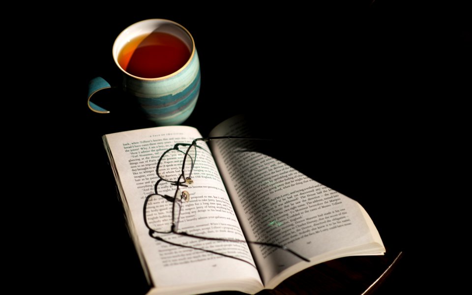 Eyeglasses On Open Book