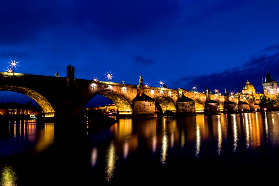 Brown And Black Concrete Bridge During Night