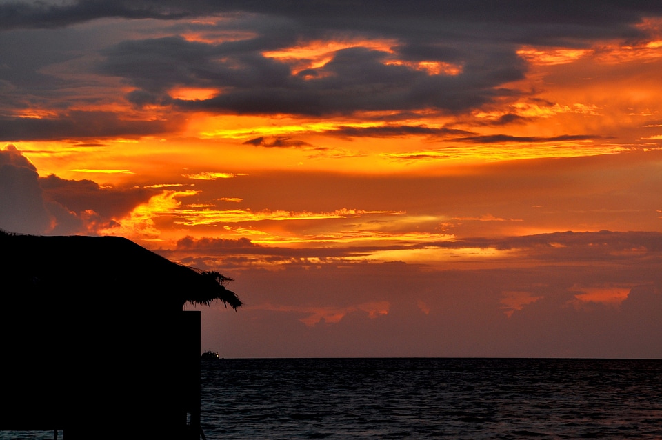 Full moon island water house sunset
