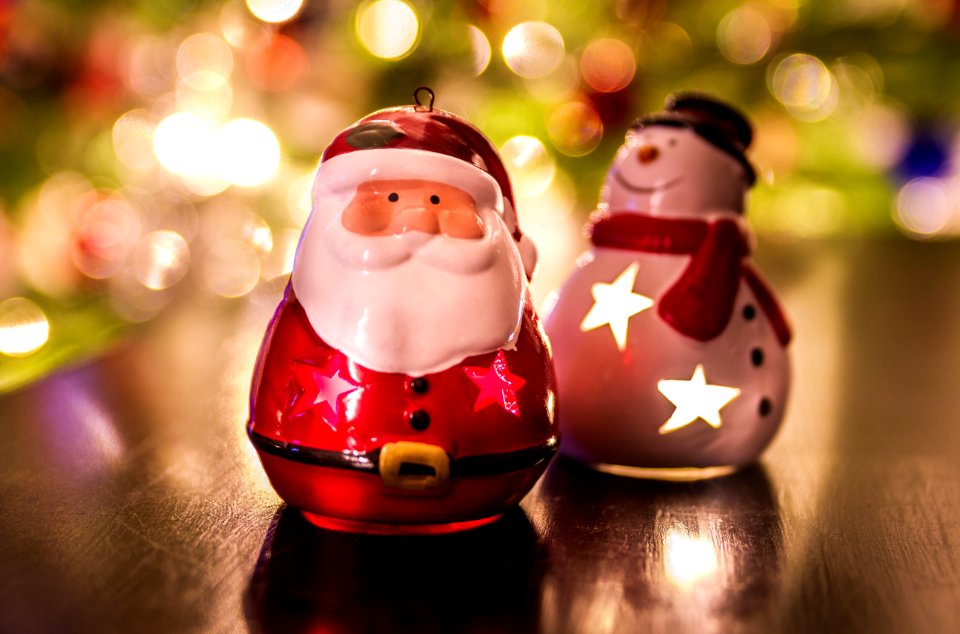 Santa Claus And Frosty Ornaments On Blurred Background