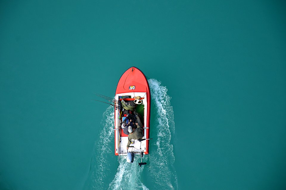 Fishermen On Motor Boat photo