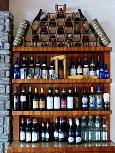 Wine shelf wine bottles photo
