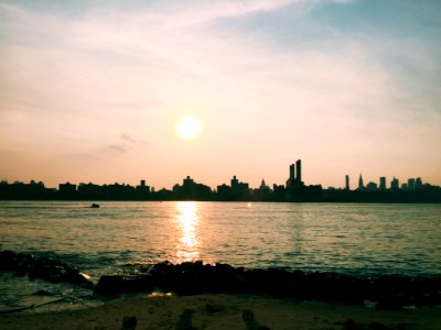 Sun Over Coastal Cityscape