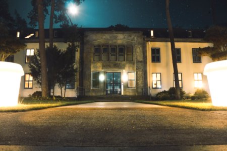 Building And Lit Courtyard At Night photo