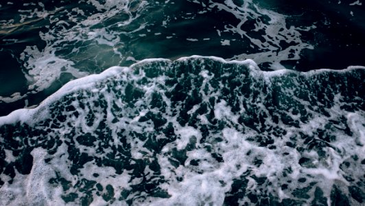 Frothy Waves In Ocean Water photo