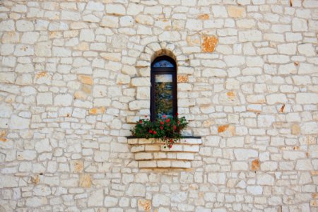 White Stone Wall With Flower Box In Window
