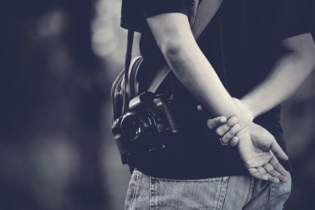 Photographer Holding Hands Behind photo