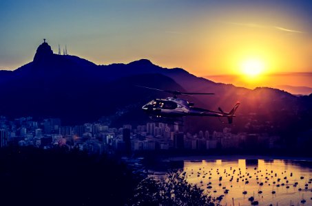 Aerial Photography Of Helicopter During Twilight photo
