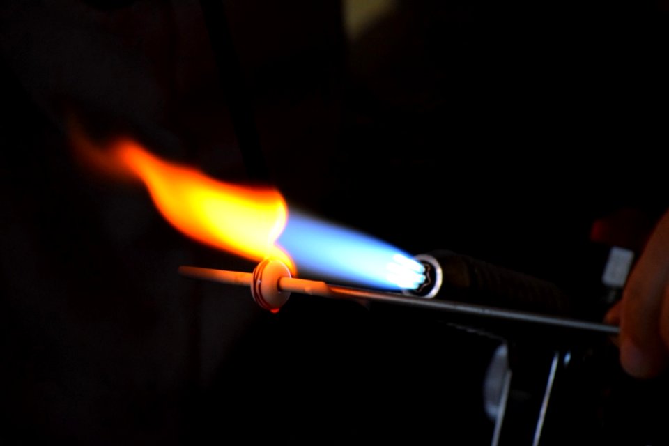 Glassworker Melting Glass
