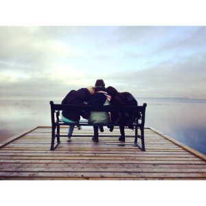 Friends On Bench At Lake