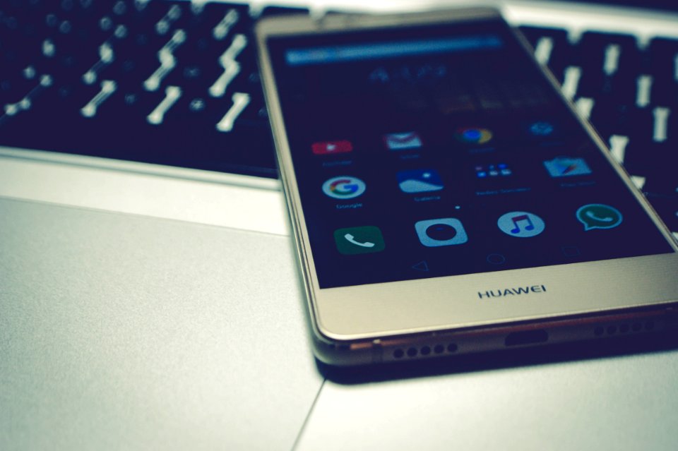 Mobile Phone On Laptop