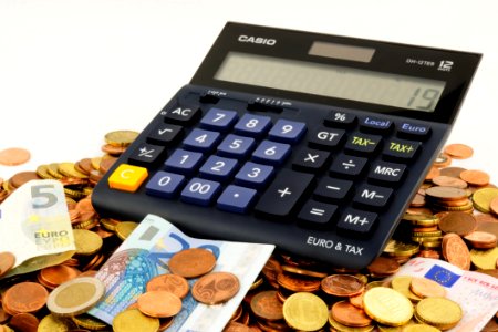 Calculator On Pile Of Euros
