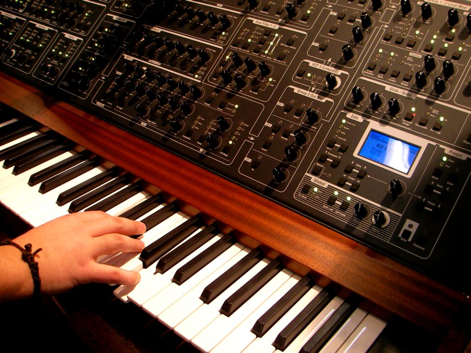 Black And White Audio Mixer On Top Of Piano