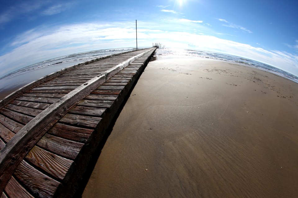Wooden Pier On Beach