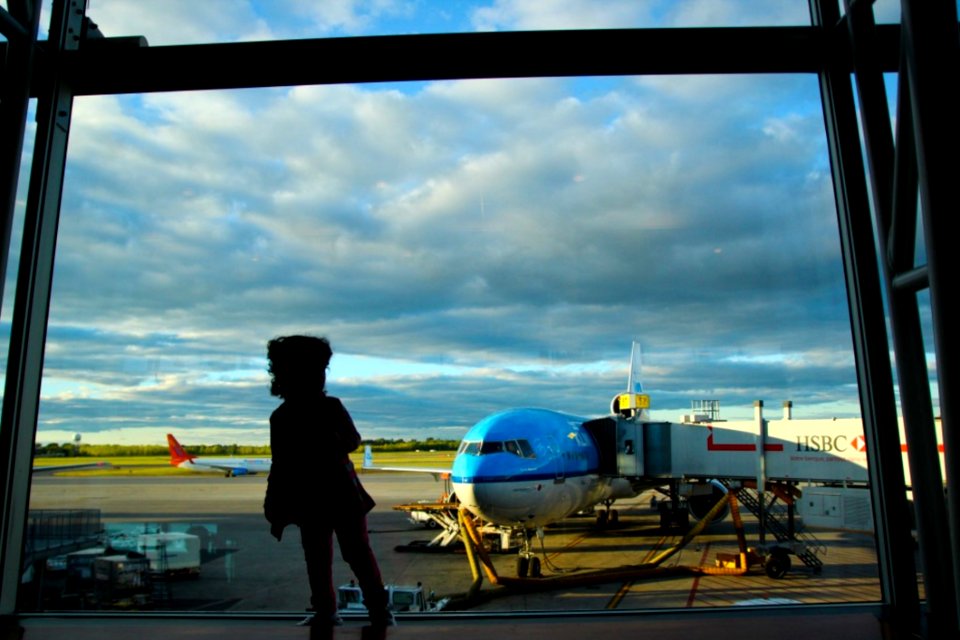 Kid Near Airport Window