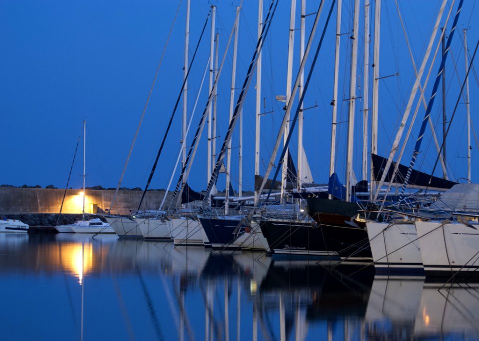 Boats In Harbor At Night