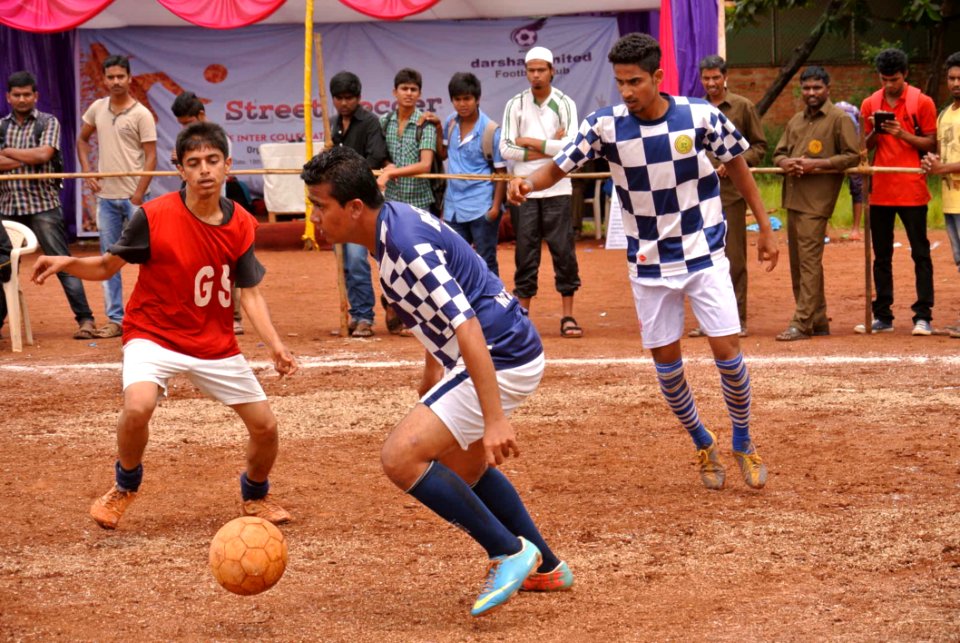 Indian Men Playing Football