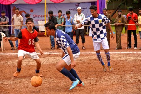 Indian Men Playing Football photo