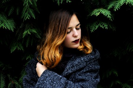 Portrait Of Young Woman In Forest During Winter photo