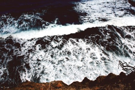 Cliff Side View Of Ocean Waves photo
