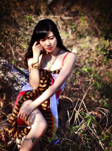 Woman In Pink White And Black Sleeveless Dress Posing For Photo photo