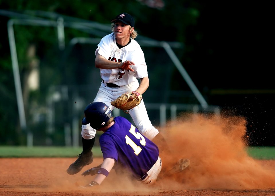 2 Man Playing Baseball On Brown Field