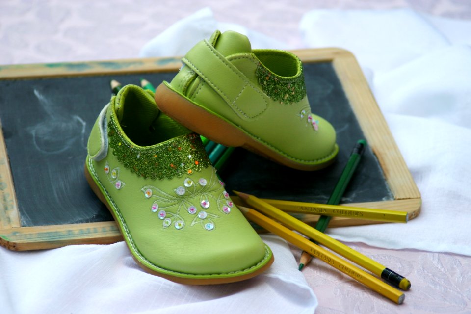 Green Slip On Shoes Near Yellow And Green Pencil