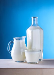 Close-up Of Milk Against Blue Background photo