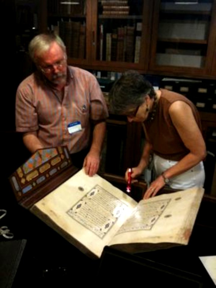 Abigail Quandt And Adam Gacek Examine A Koran