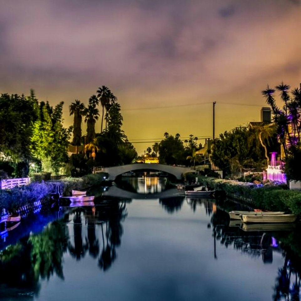 White Bridge Above River Under Grey Sky During Sunset photo