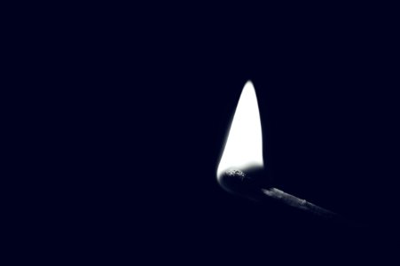 Lighted Match With Dark Background