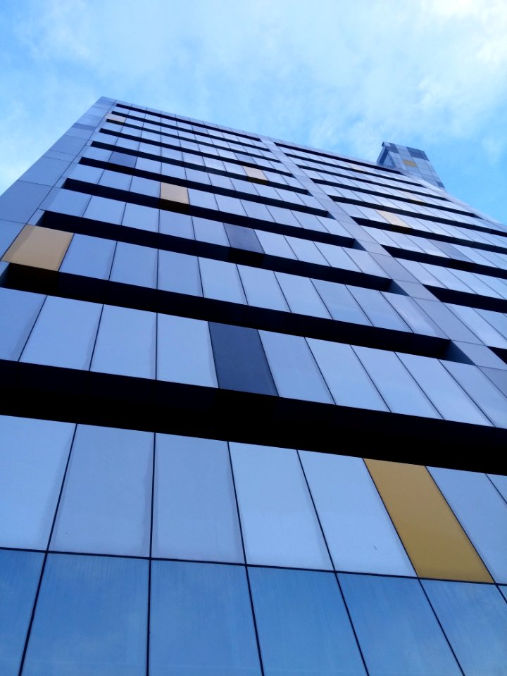 Multi Colored Face Of A High Rise Building