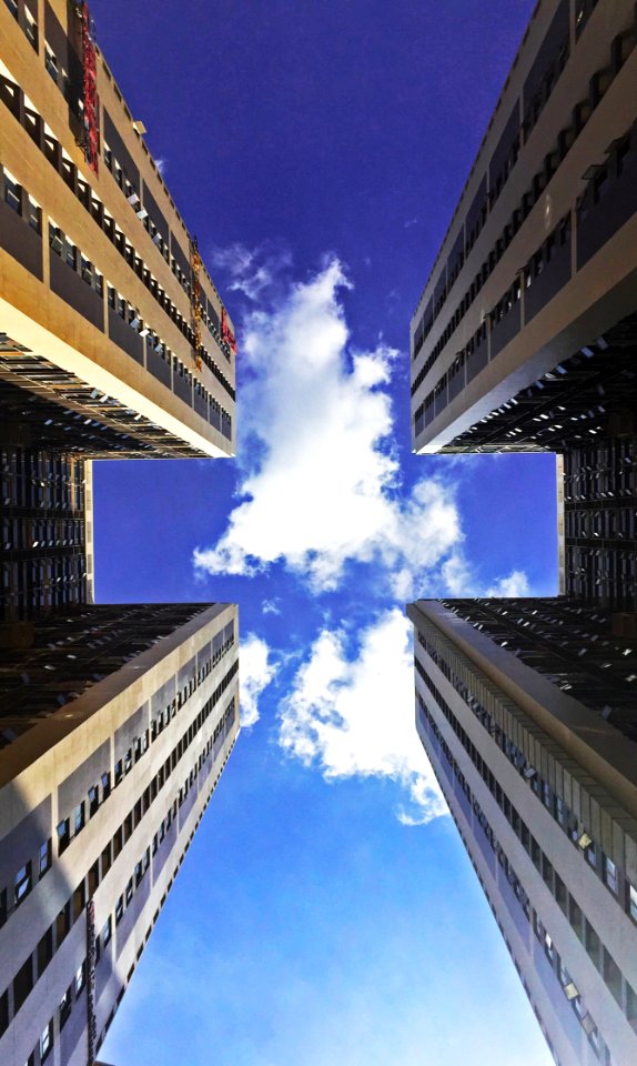 Low Angle View Of Skyscraper Against Cloudy Sky photo