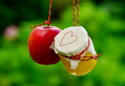 Red Apple Fruit Beside Clear Glass Jar photo