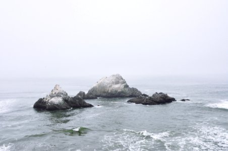 Rock Outcrops In Stormy Ocean photo
