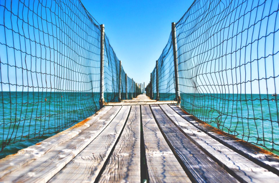 Fenced Wooden Boardwalk Over Ocean