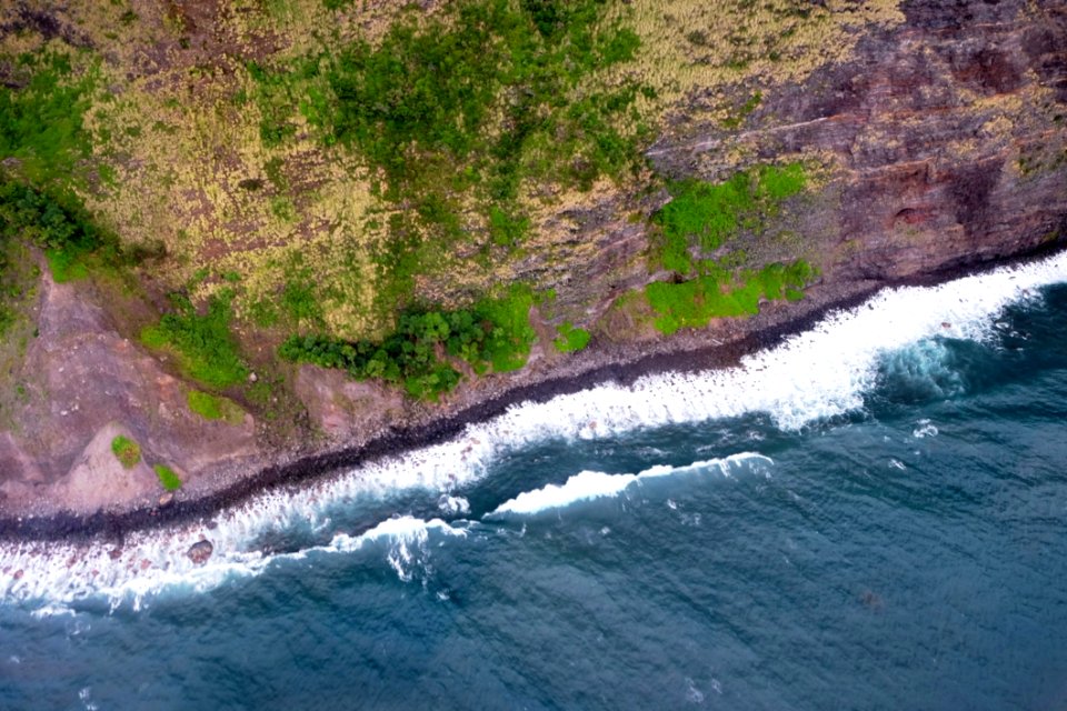 Sky View Of Ocean Against Cliff