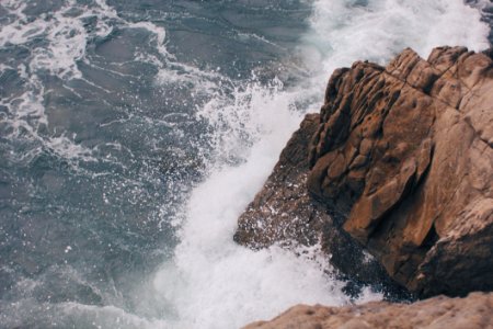 Ocean Waves Hitting An Outcrop photo