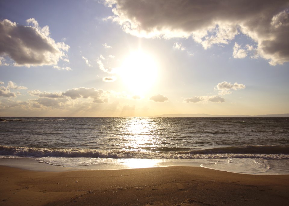 Sun Shining On Ocean Beach