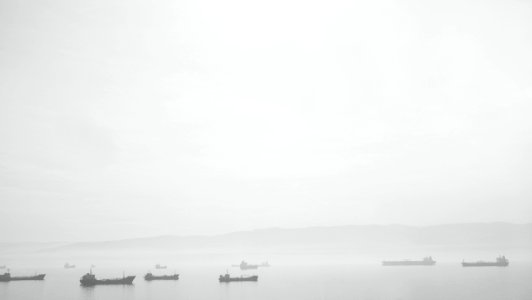 Ships In Water With Fog