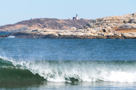 Breaking In Front Of Island Lighthouse