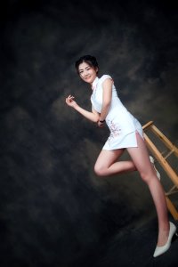 Asian Woman In Short White Dress photo