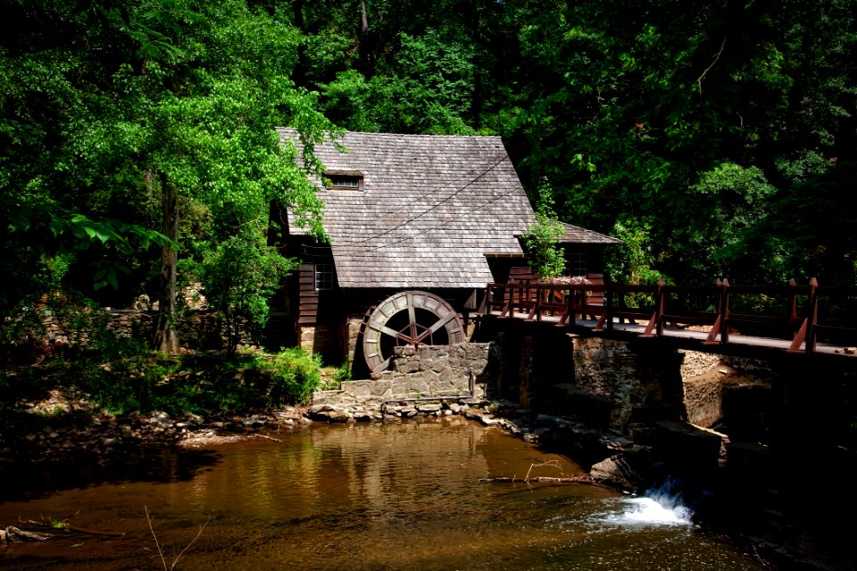 Brown House Near River Trees And Bridge
