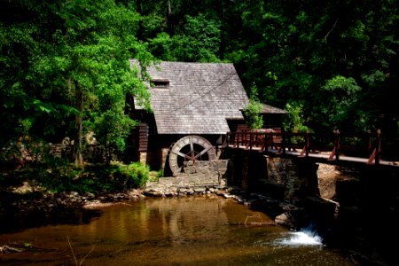 Brown House Near River Trees And Bridge