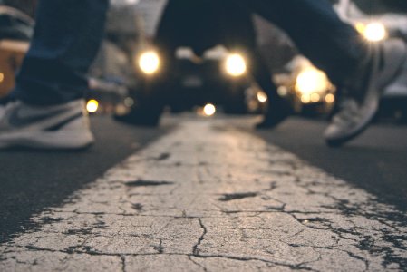 Feet Of Pedestrians Crossing Road