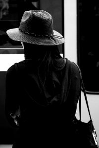 Greyscale Photo Of A Woman Wearing A Hat photo