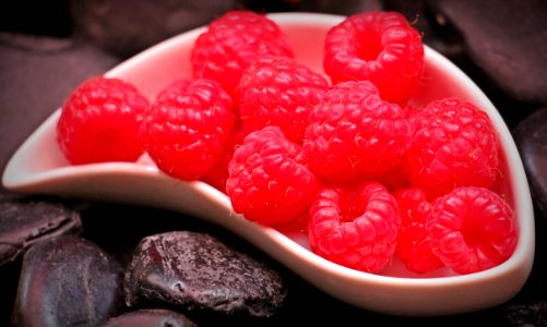 Red Raspberry Fruit On White Ceramic Tray photo